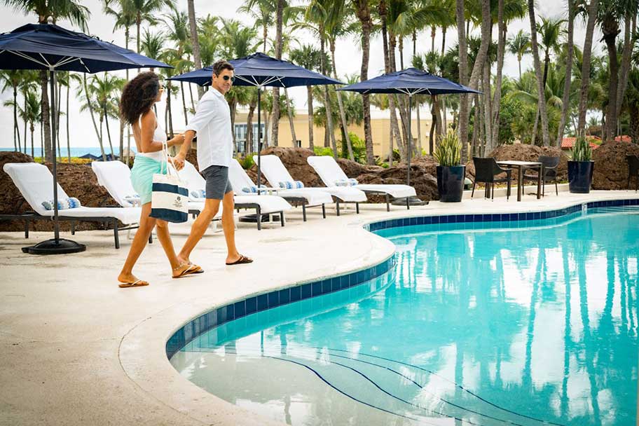 Couple by resort pool