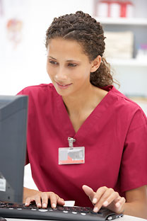 Image of nurse working on computer