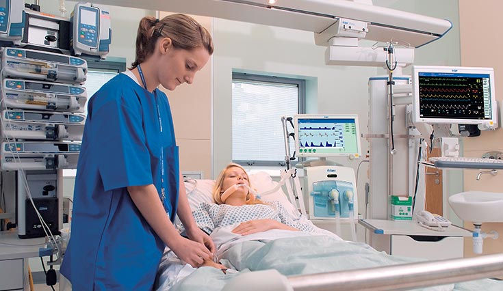 Image of nurse helping patient