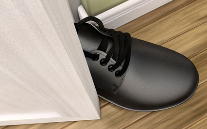 Image of a foot stepping in the door