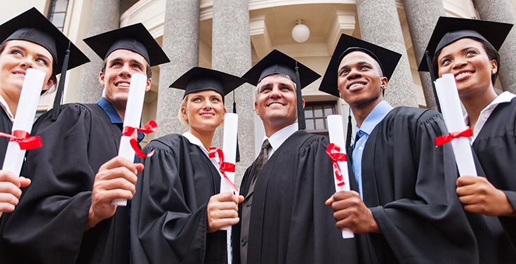 Image of six graduates holding their diplomas