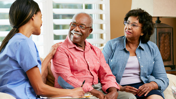 image of health care provider working with patients outside of hospital room