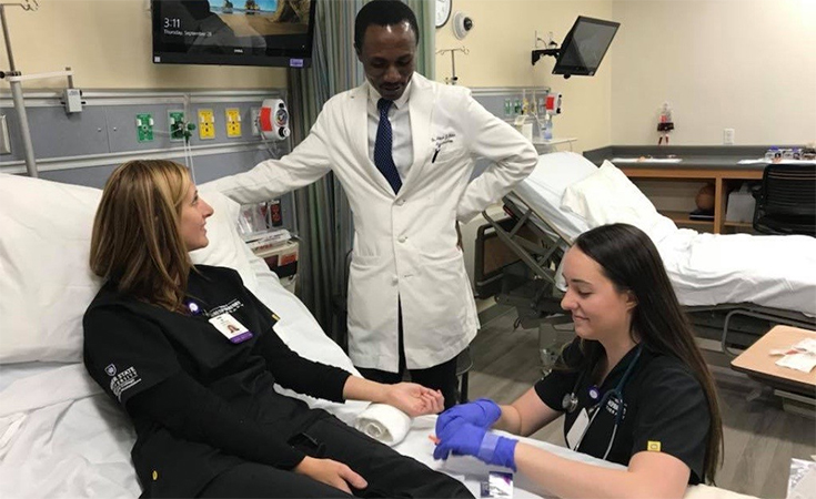 Aidoo spending time with RT students at Weber State University