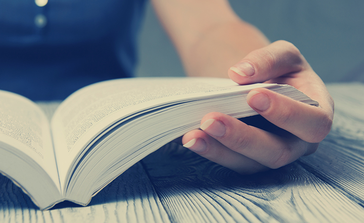 image of woman reading book