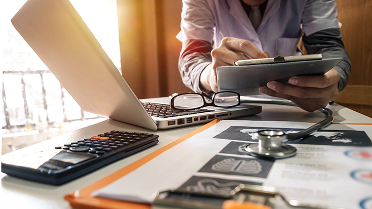 Image of doctor working at desk