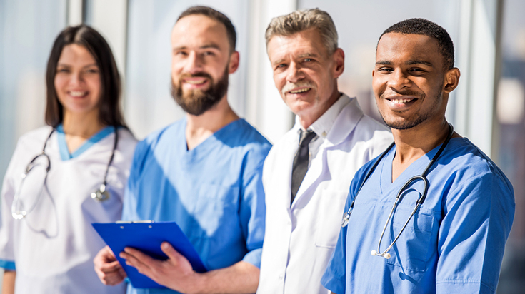 Image of four doctors smiling