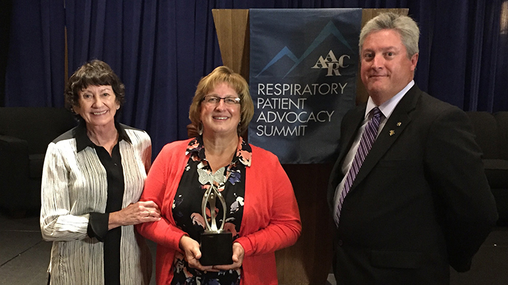 Christine Hartling (center) receiving award