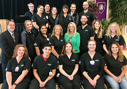 Jose Perez (front row, second from left) with fellow students following a presentation