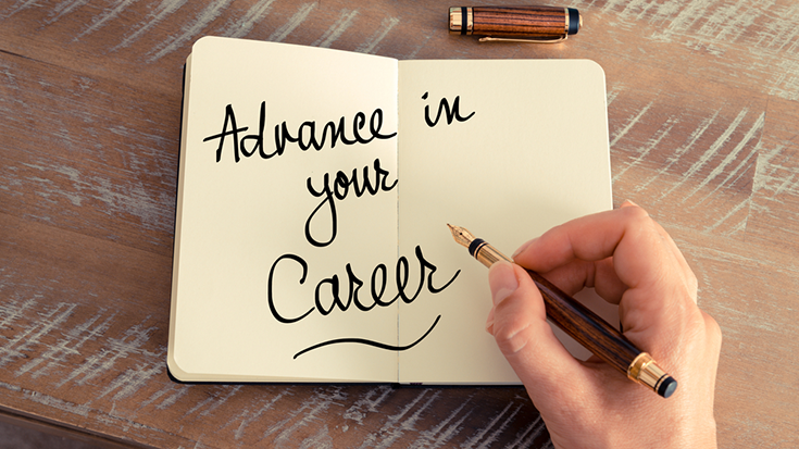 Image of notebook with written message "Advance in your career"