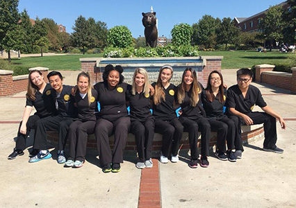 photo of alicia thomas with classmates at school