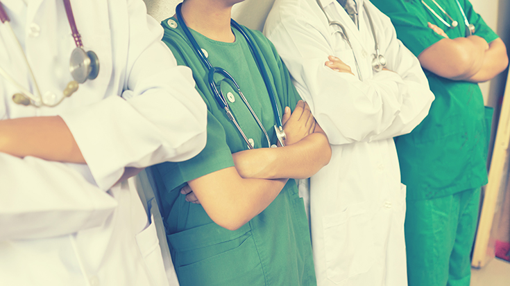 image of four doctors with their arms crossed