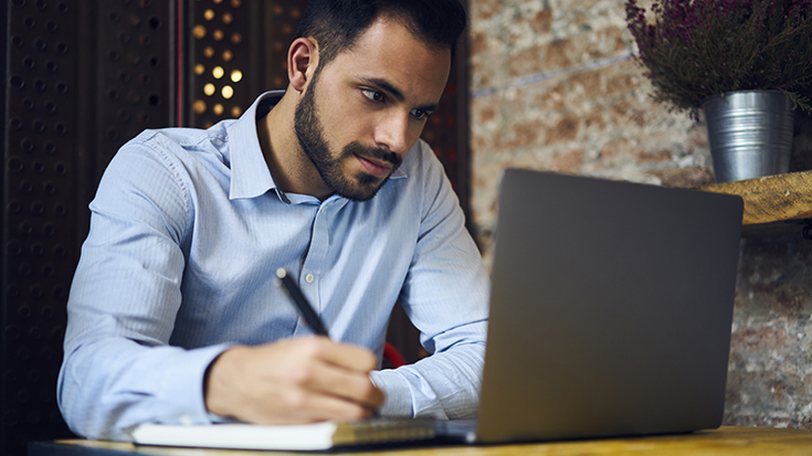 Image of man working on computer