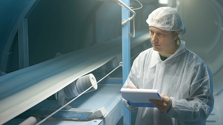 image of worker conducting sugar control check at food manufacturing plant 
