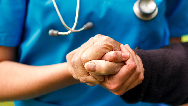 image of RT holding hand of a patient