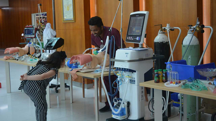 visitor exploring respiratory equipment display