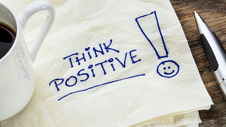 image of drink napkin with "think positive" handwritten on it