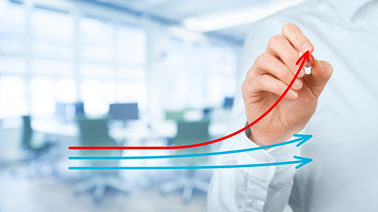 image of man drawing charts on window with office scene in background