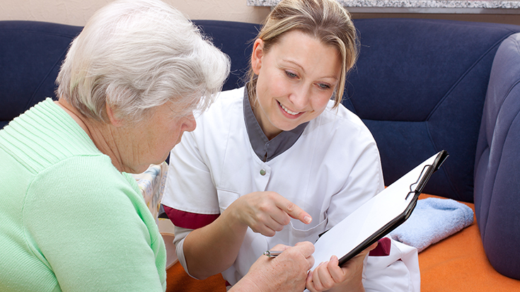 image of medical professional working with older woman