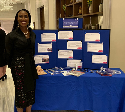 Photo of Julie Essiam hosting a booth at the African Union Summit