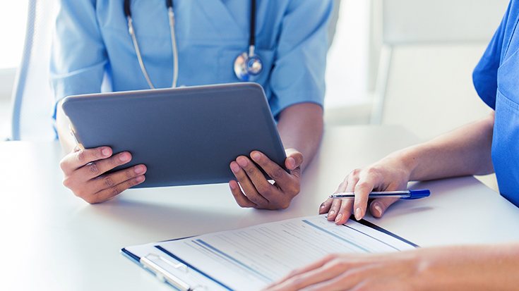 image of medical professionals meeting one-on-one