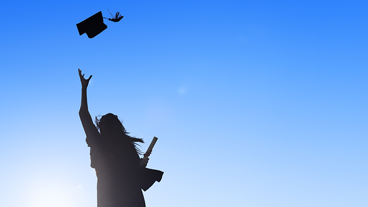 Image of graduate throwing their cap in the air