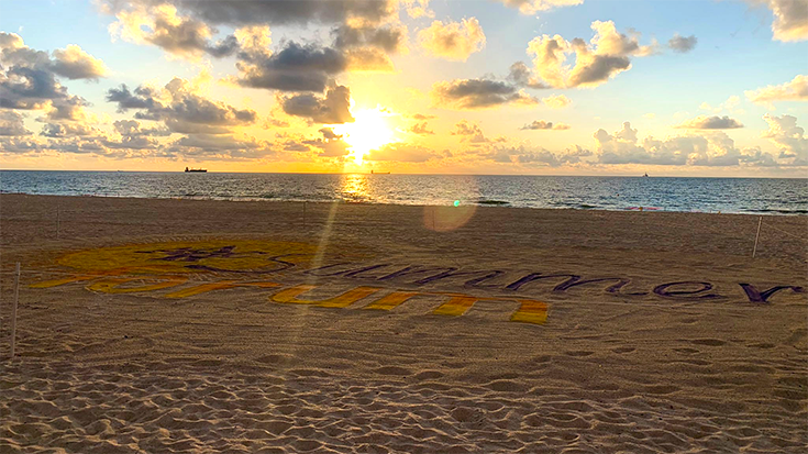 beach scene with summer forum logo
