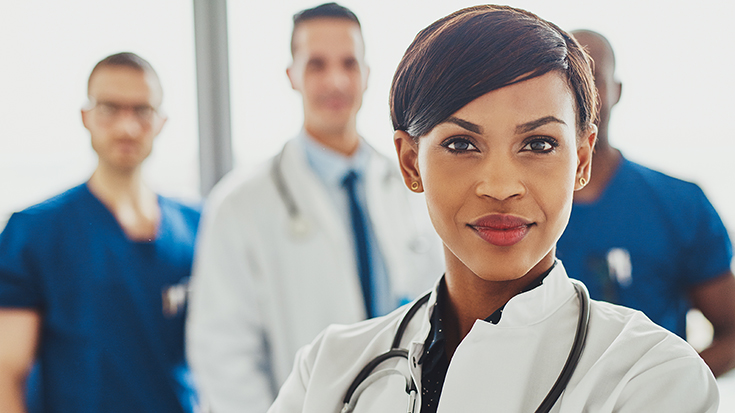 confident respiratory manager with colleagues in the background