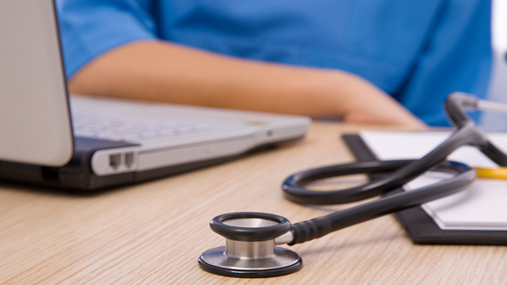 respiratory therapist sitting at desk