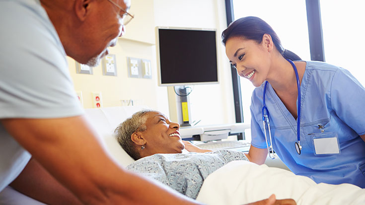 Image of nurse smiling with patient