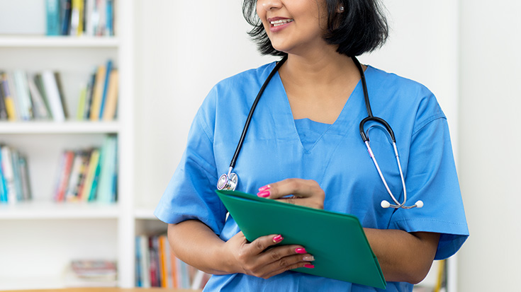 Image of doctor holding folder