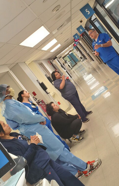 RTs, RNs, an EKG tech, and physicians at Renato Galindo’s hospital debrief