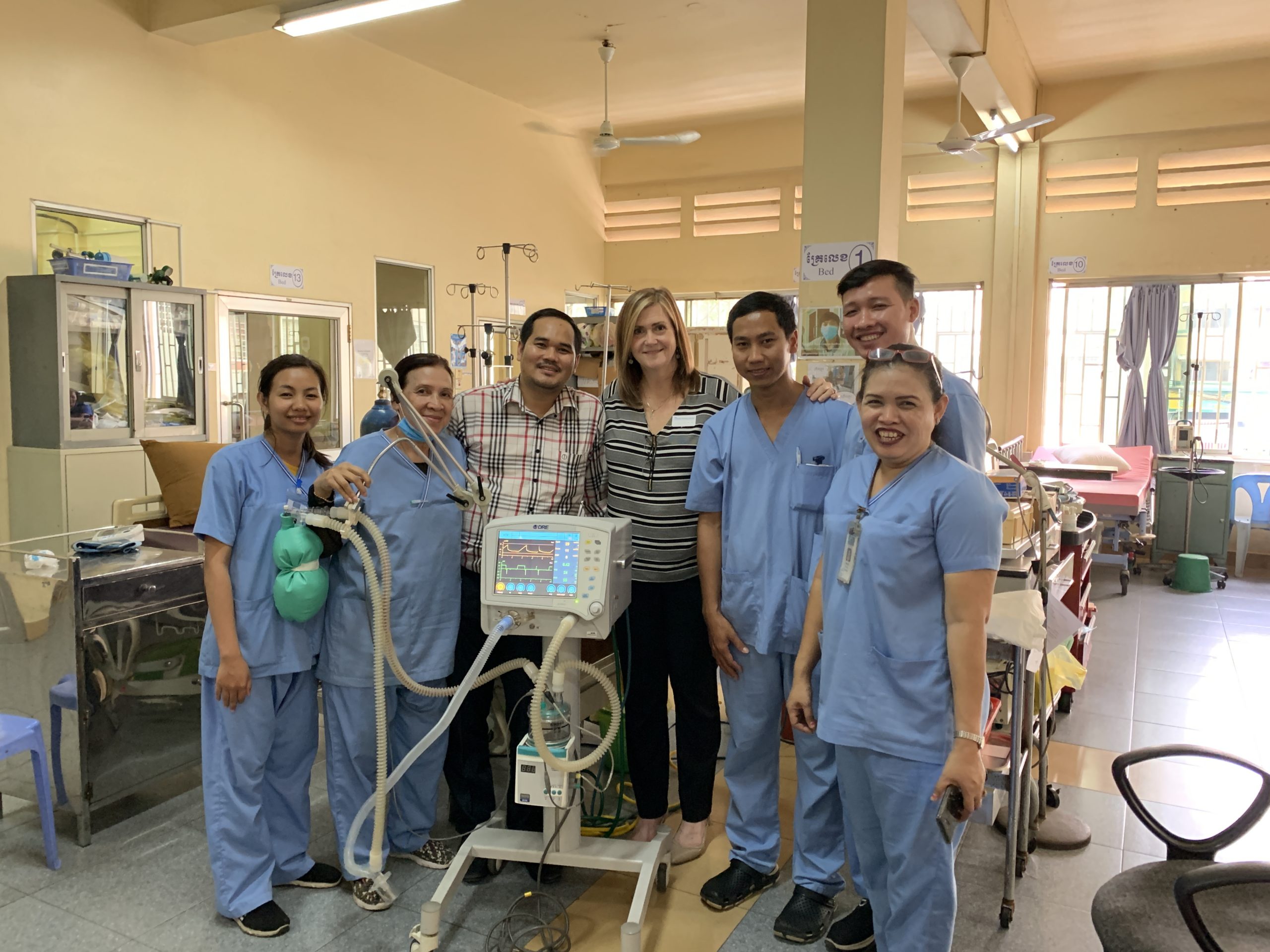 Image of Lisa Trujillo with colleagues at Sihanouk Hospital Center