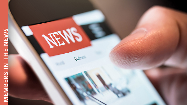 image of person scrolling through news feed on phone