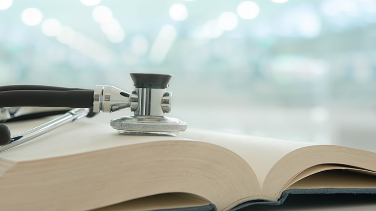 stethoscope on medical guide