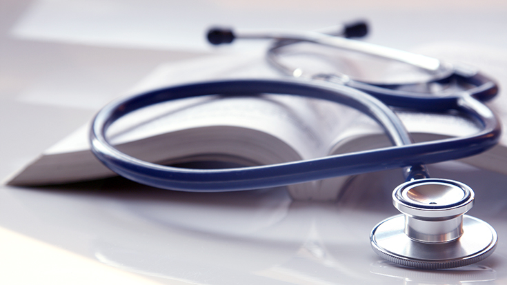 book with stethoscope on it