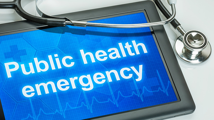 image of tablet with words Public health emergency displayed