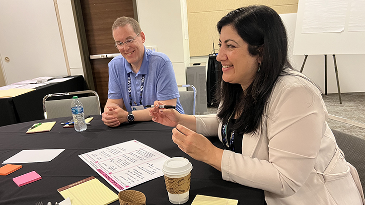 Georgianna Sergakis and Joe Goss work together during a strategic planning exercise.