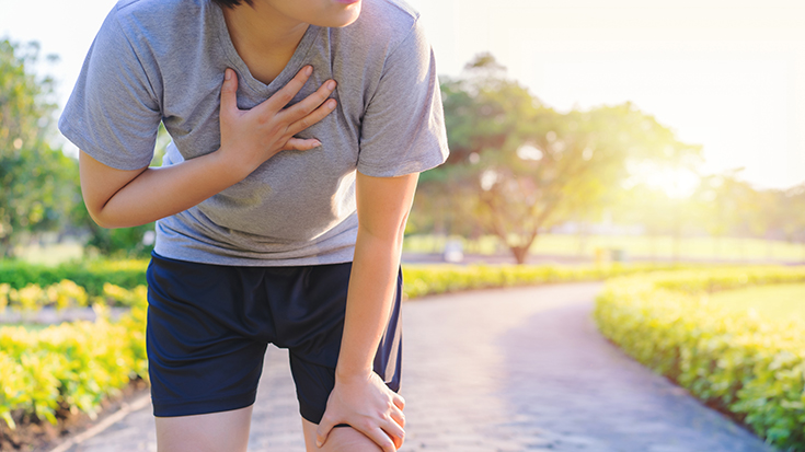 image of woman having difficulty breathing