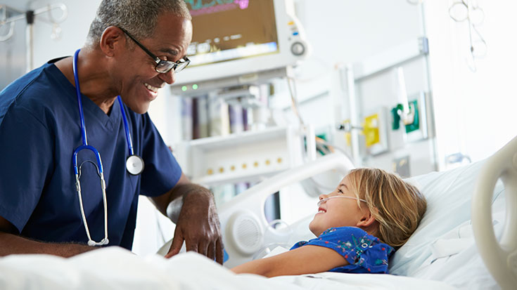 image of rt health care provider talking with child patient